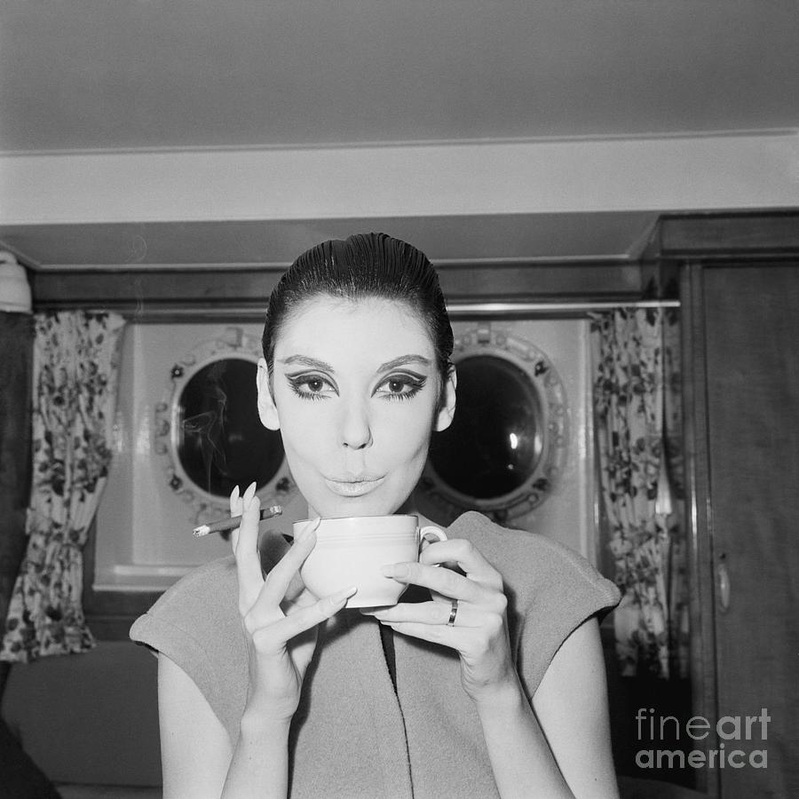 Peggy Moffit Drinking And Smoking by Bettmann