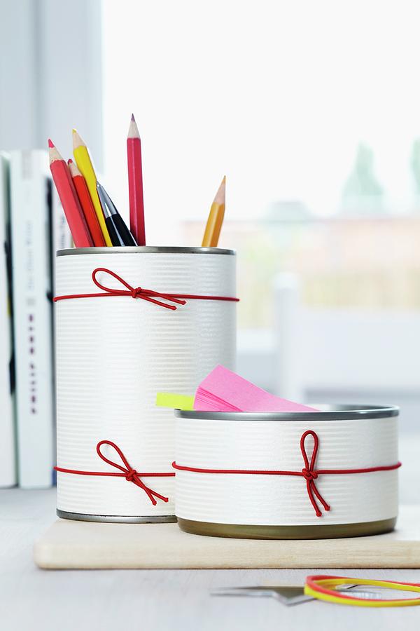 Crayon Photograph - Pencil Holders Made From Tin Cans Decorated With Paper And Rubber Bands by Franziska Taube