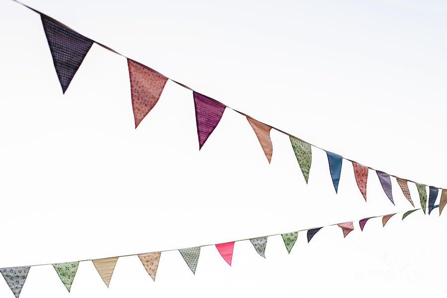 Pennants with blue sky background. Photograph by Joaquin Corbalan