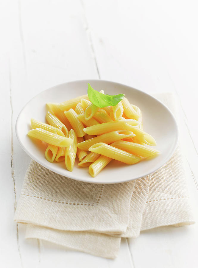Penne In Plate With Napkin Photograph by Westend61