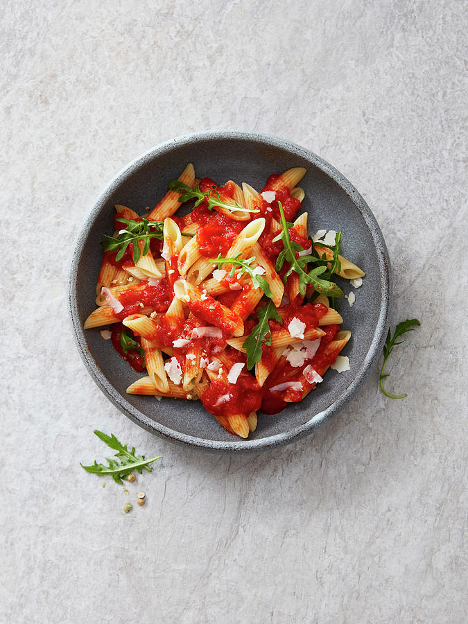 Penne With Tomato Sauce, Rocket And Green Pepper Photograph by Thorsten Kleine Holthaus