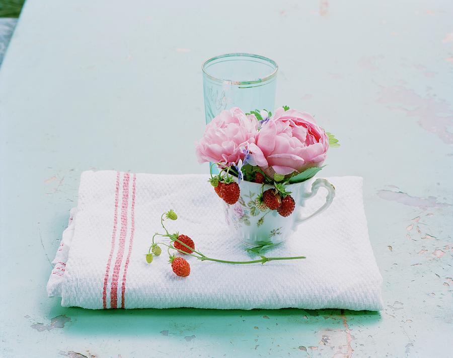 Peonies And Wild Strawberries In Teacup Photograph by Matthias Hoffmann