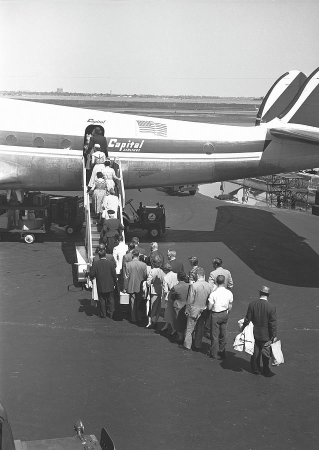 People Boarding On Airplane, Rear View Photograph by George Marks