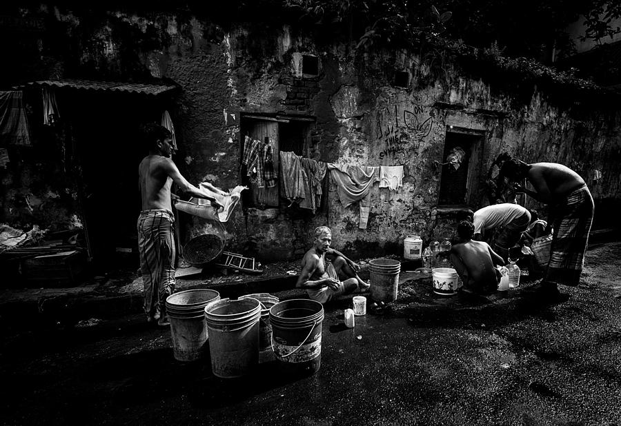 People Cleaning Themself In The Streets Of Calcutta. Photograph by Joxe Inazio Kuesta Garmendia