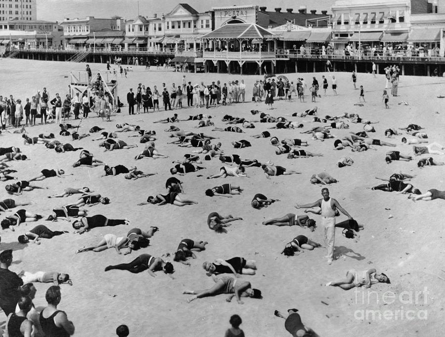 People Performing Relaxing Exercises Photograph by Bettmann