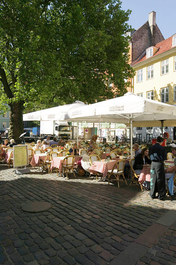 People Sitting At Sole Ditalia Restaurant In Grabrodretorv Square, Copenhagen, Denmark Photograph by Jalag / Paul Spierenburg