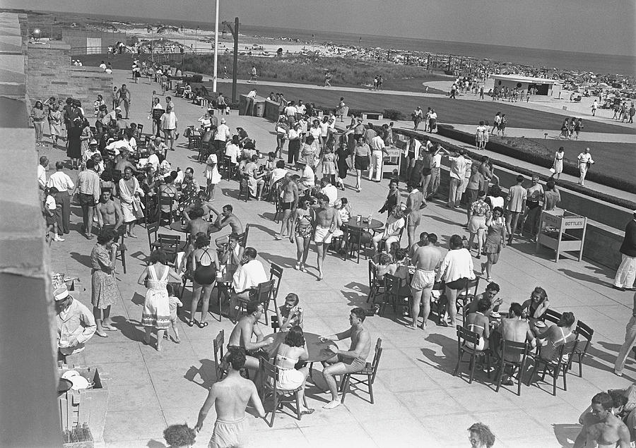 People Sitting At Tables By Beach, B&w Photograph by George Marks