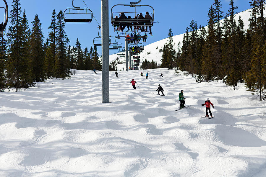 People Skiing Under Ski Lift Photograph by Johner Images