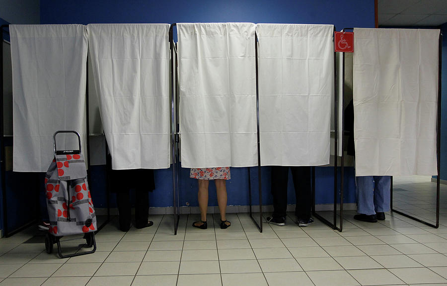 People Stand in Voting Booths Photograph by Emmanuel Foudrot - Fine Art ...