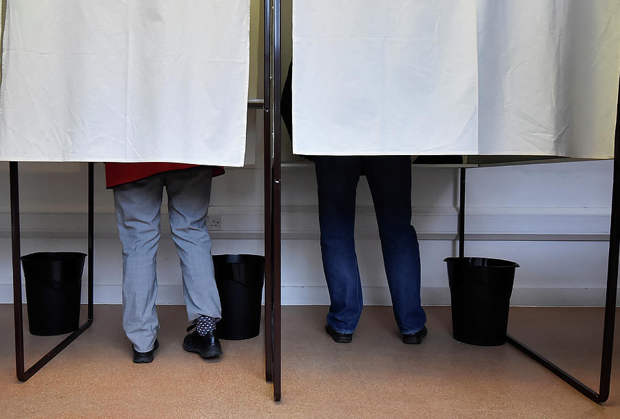 People Stand in Voting Booths Photograph by Hannah Mckay - Fine Art America