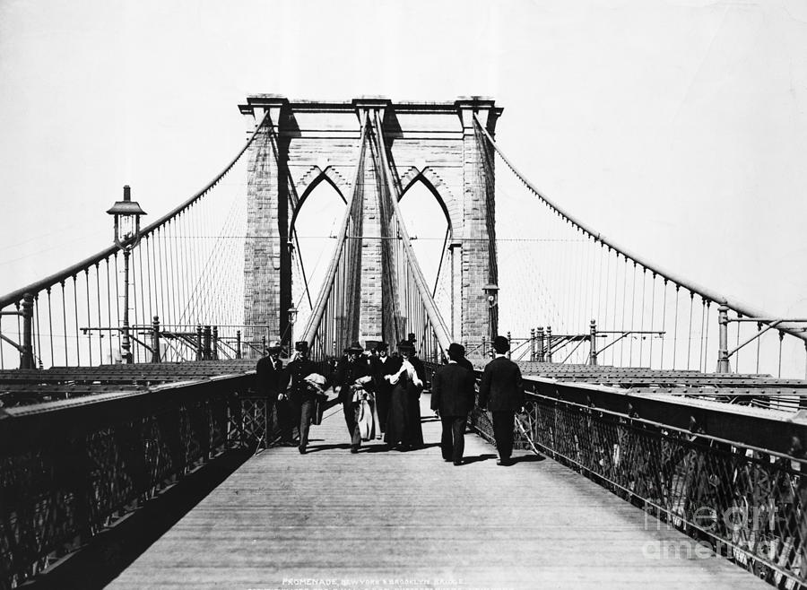 People Strolling Along The Brooklyn Photograph by Bettmann