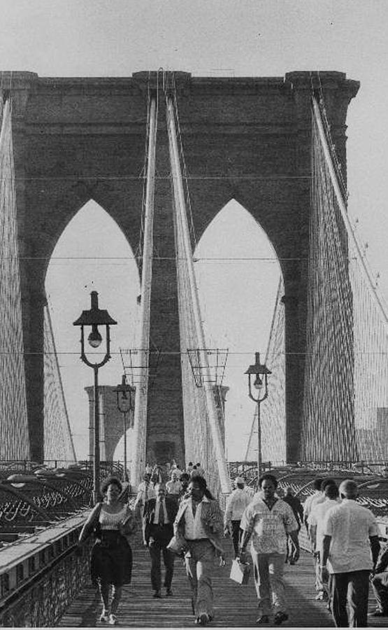 People Walk Across The Brooklyn Bridge Photograph by New York Daily News Archive