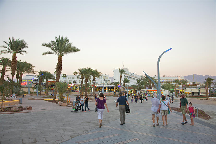People Walking On Stone Plaza Near Palm Photograph by Barry Winiker People Walking On Stone Plaza Near Palm Photograph by Barry Winiker