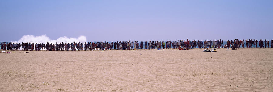 Nature Photograph - People Watching The Waves On The Beach by Panoramic Images