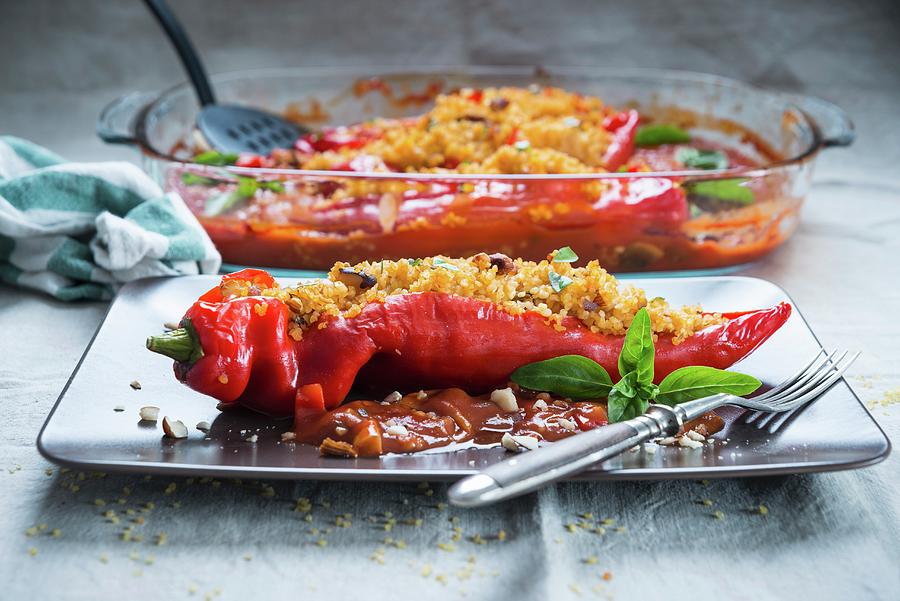 Peppers Stuffed With Bulgur Wheat And Nuts In Tomato Sauce vegan Photograph by Kati Neudert