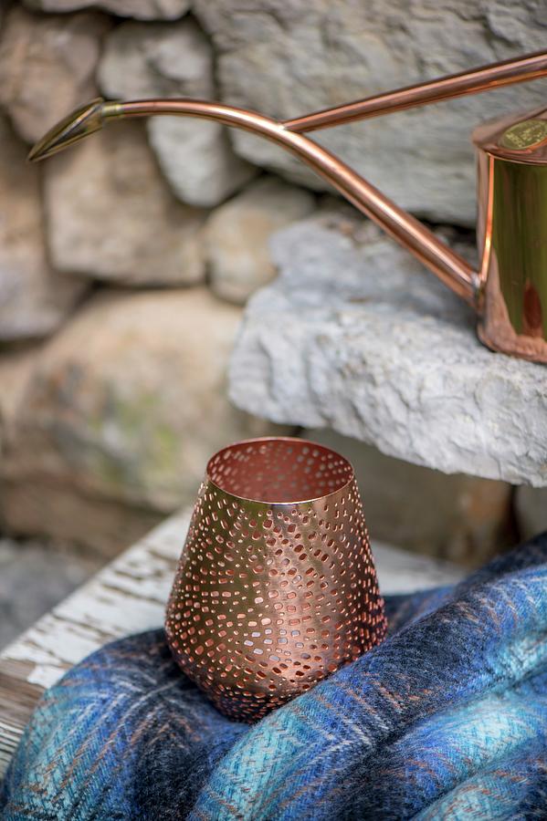 Perforated Copper Tealight Holder In Front Of Stone Wall Photograph by Winfried Heinze
