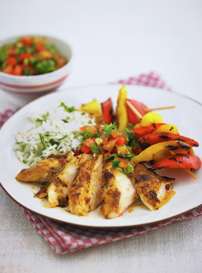 Peri-peri Chicken With A Pepper Skewer And Rice Photograph by Myles New