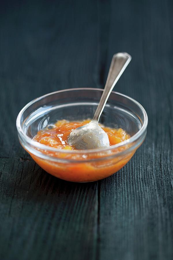 Persimmon Jam With Ginger In A Small Glass Bowl Photograph by Martina Schindler