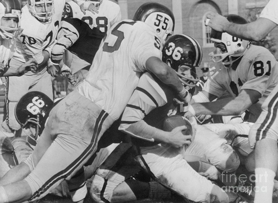 Pete Thorbahn Being Tackled Photograph by Bettmann