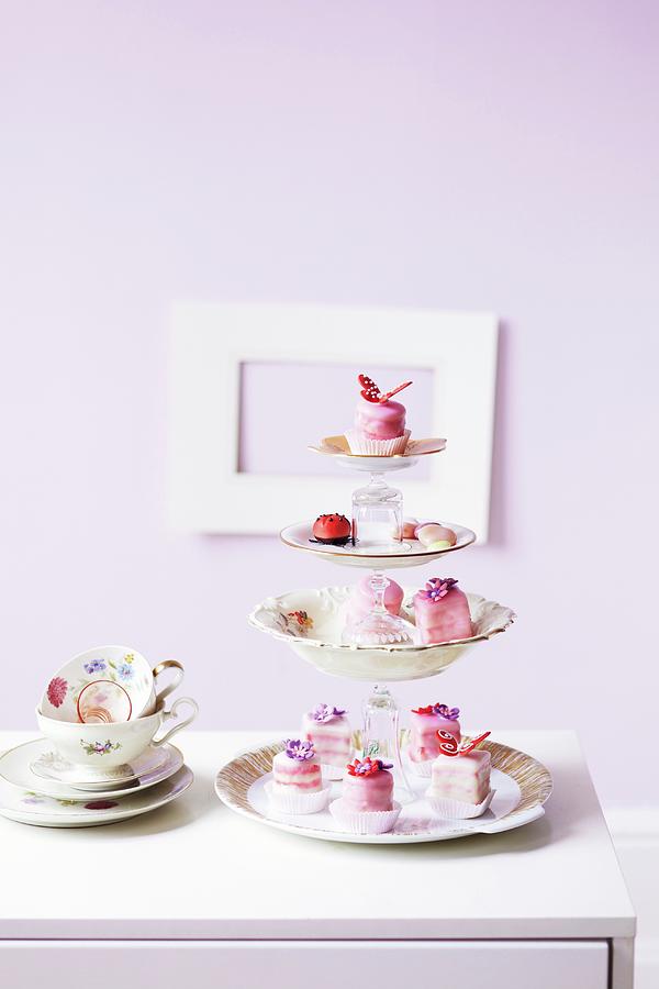Petit Fours On A Homemade Cake Stand Photograph by Jalag / Janne Peters