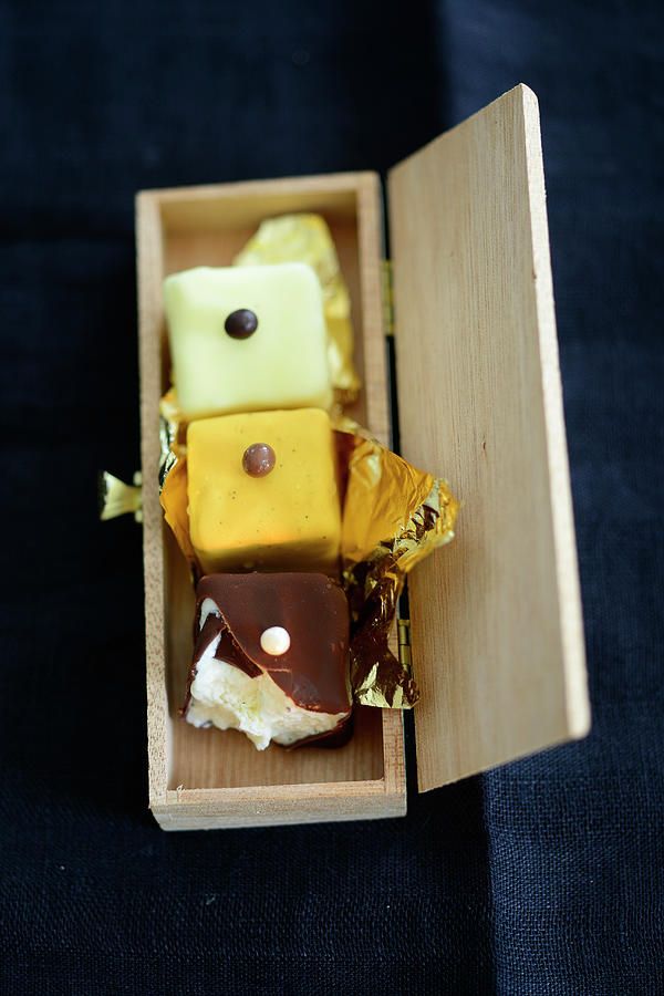 Petit Fours With Gold Foil In A Wooden Box Photograph by Tanja Major