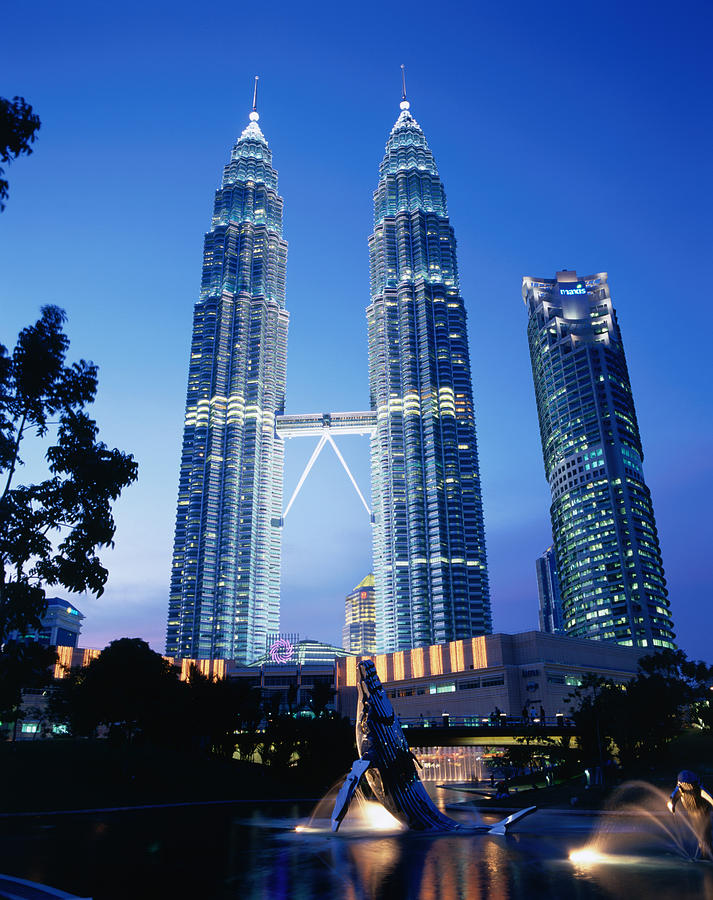 Petronas Twin Towers In Evening Light Photograph by Manfred Gottschalk