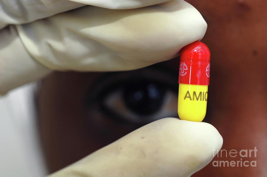 Pharmaceutical Worker Holding A Freshly Made Drugs Capsule Photograph by Medicimage / Science Photo Library