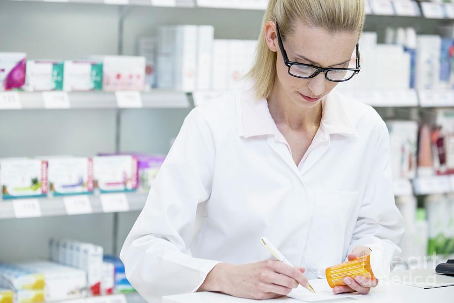 Pharmacist Writing On Prescription Photograph by Science Photo Library |  Fine Art America