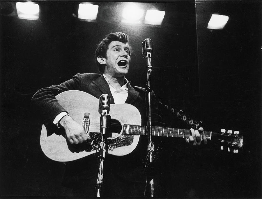 Phil Ochs Performs On Stage Photograph by Fred W. McDarrah