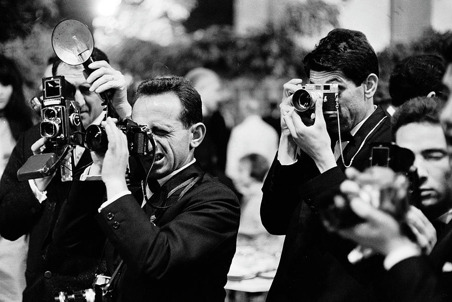 Black And White Photograph - Photographers At The Cannes Film Festival by Paul Schutzer