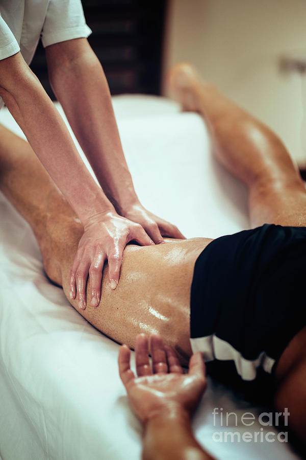Physical Therapist Massaging Leg Photograph by Microgen Images/science Photo Library