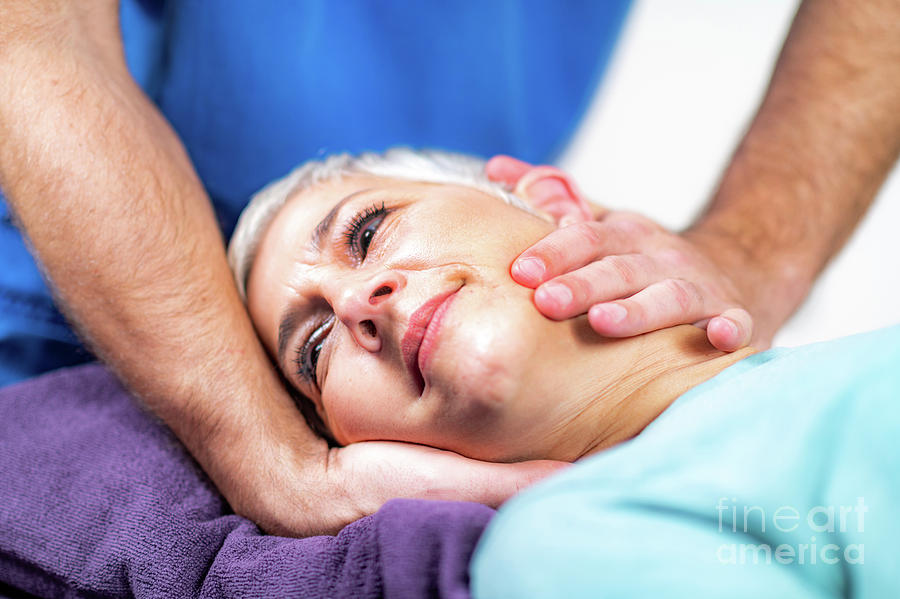 Physical Therapist Stretching Senior Womans Neck Photograph by Microgen Images/science Photo Library