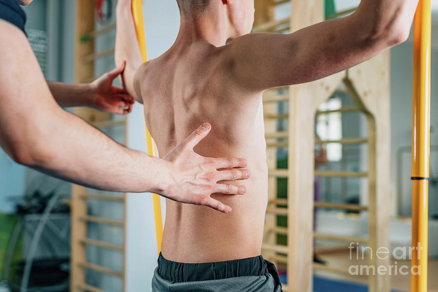 Physical Therapist With Teenage Boy Photograph by Microgen Images/science Photo Library