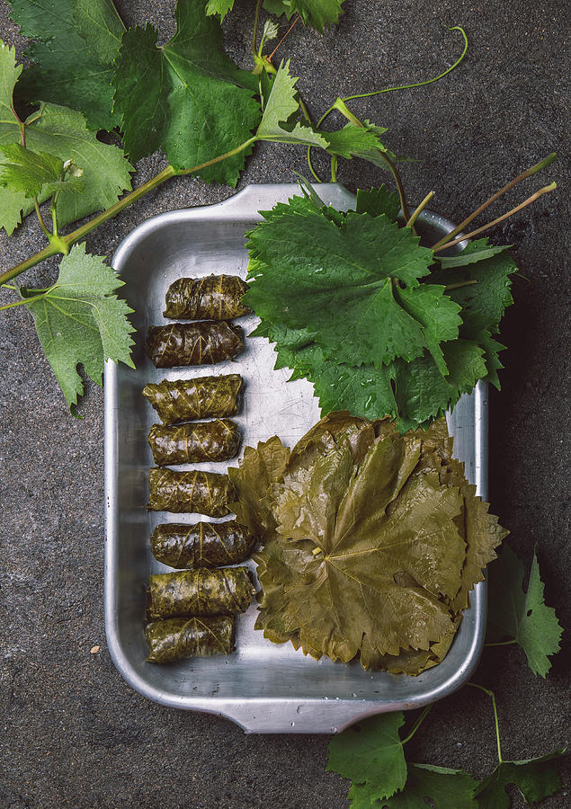 Pickled And Stuffed Vine Leaves In Aluminium Foil Photograph by Larisa Blinova