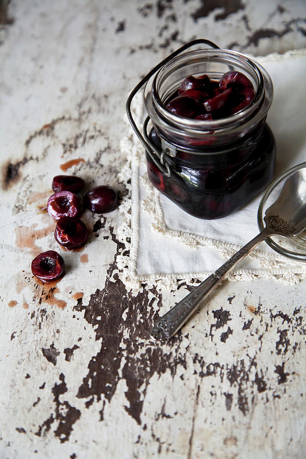Pickled Cherries In Vintage Glass Jar Photograph by Kelly Sterling Photography