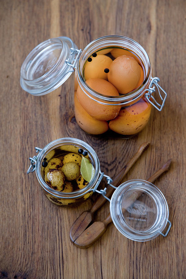 Pickled Chicken And Quail Eggs Photograph by Michael Wissing