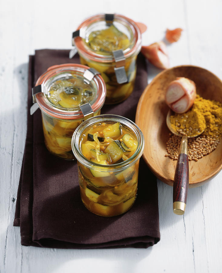 Pickled Curried Courgette In White Wine Vinegar, Peppers And Mustard In Jars Photograph by Teubner Foodfoto