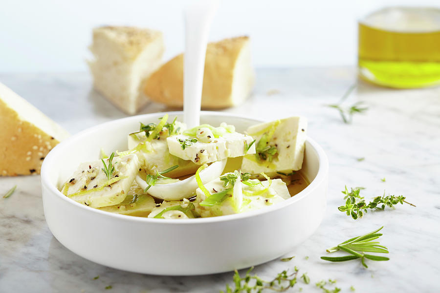 Pickled Feta Cheese In Olive Oil With Garlic, Spring Onions, Thyme, Rosemary And Lemon Pepper Photograph by Teubner Foodfoto