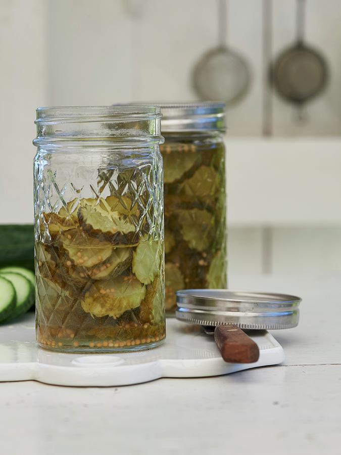 Pickled Gherkins In Jar Photograph by Hannah Kompanik
