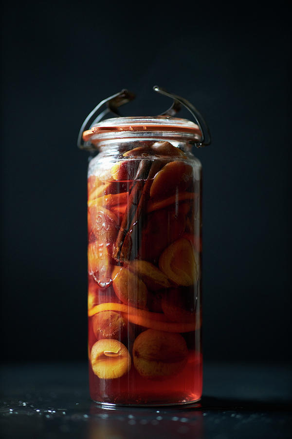 Pickled Plums In A Jar Photograph by Oliver Brachat