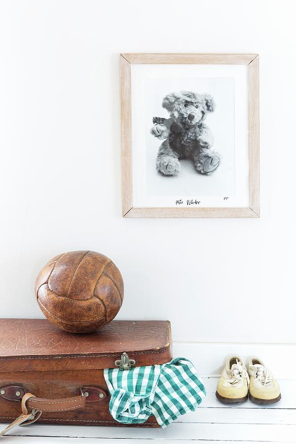 Picture On Wall Above Teddy Bear, Old Ball, Leather Suitcase And Childrens Shoes Photograph by Catja Vedder