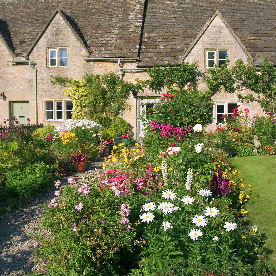 Picturesque Cotswolds - idyllic cottage gardens in Bibury Photograph by Seeables Visual Arts