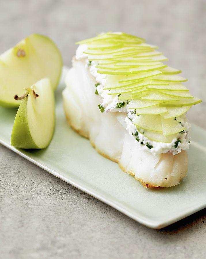 Piece Of Cod Topped With Fromage Frais With Herbs And Potato Scales Photograph by Bagros