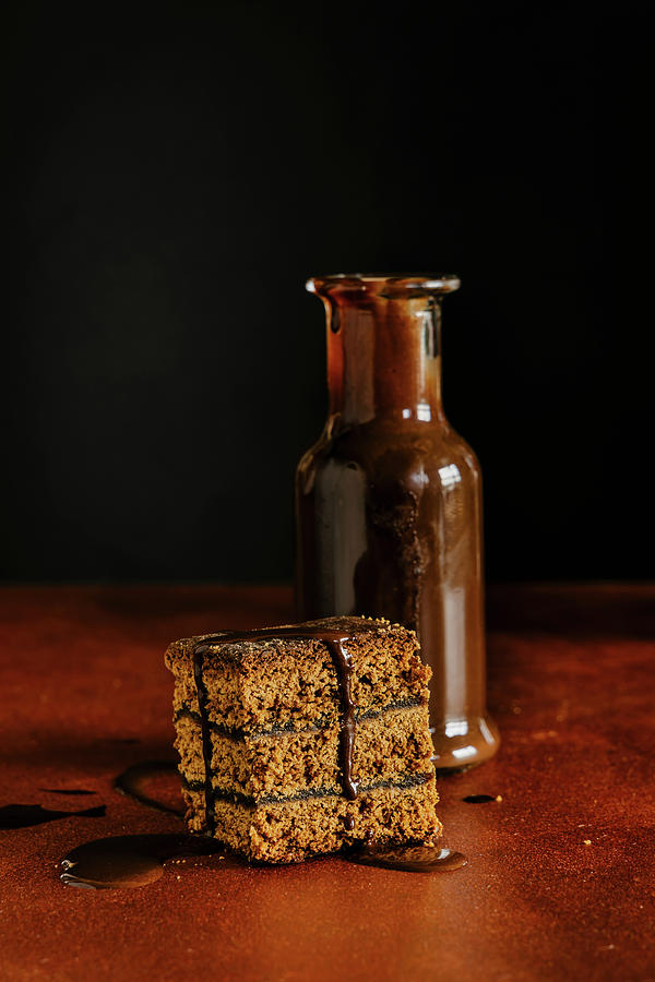 Piece Of Honey Gingerbread Cake And Chocolate Sauce Photograph by Alla Machutt