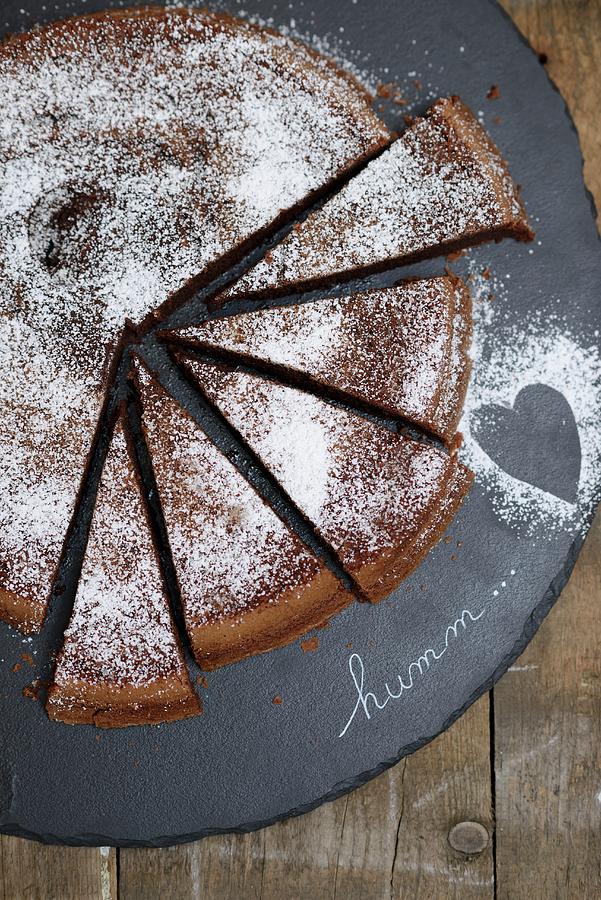 Piece Of Midnight Chocolate Sheet Cake With Powdered Sugar Photograph ...