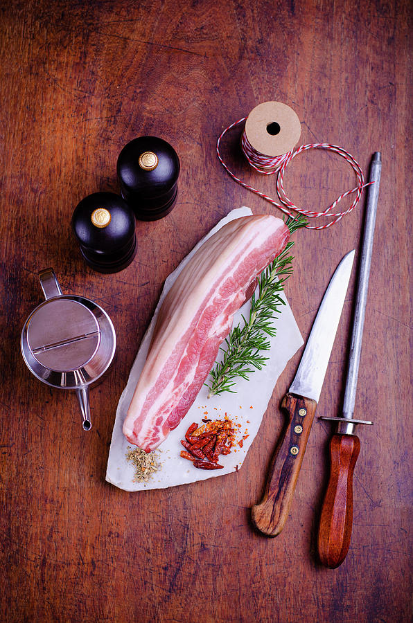 Piece Of Pork Belly With A Sprig Of Rosemary Photograph by Jamie Watson