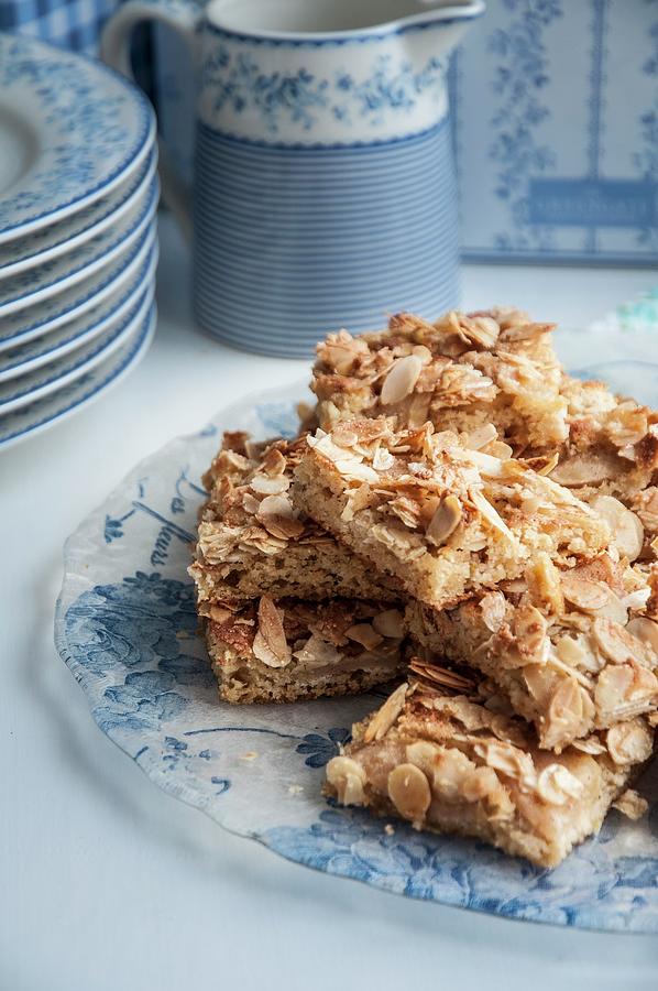 Pieces Of Almond And Apple Tray Bake On A Serving Plate Photograph by Healthylauracom