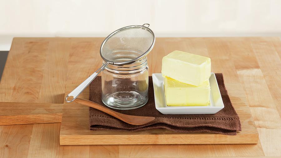 Pieces Of Butter, A Jar And A Sieve For Making Ghee Photograph by Eising Studio - Food Photo & Video