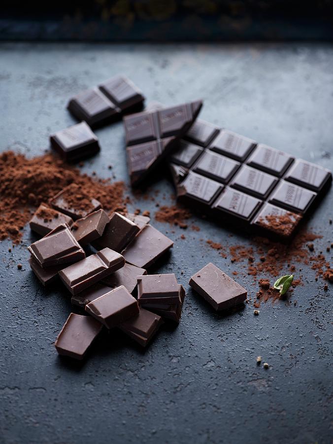 Pieces Of Chocolate, A Bar Of Chocolate And Cocoa Powder Photograph by ...