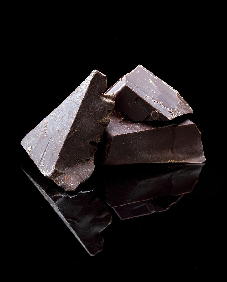 Pieces Of Dark Chocolate On Black Photograph by Ray Kachatorian
